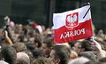 A-mourner-waves-a-Polish--001_300x180