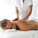 Young woman having back massaged