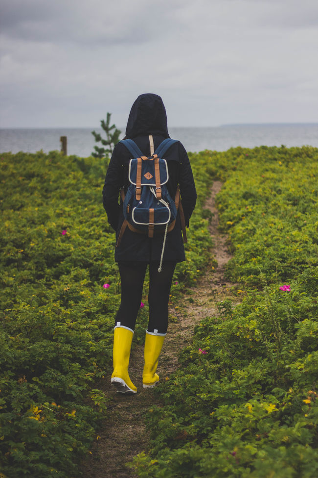 Canva - Person in Black Hooded Jacket Walking on Pathway Under Cloudy Sky