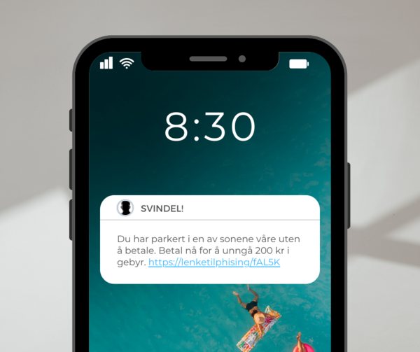 Bilde av mobiltelefon med melding om svindel.