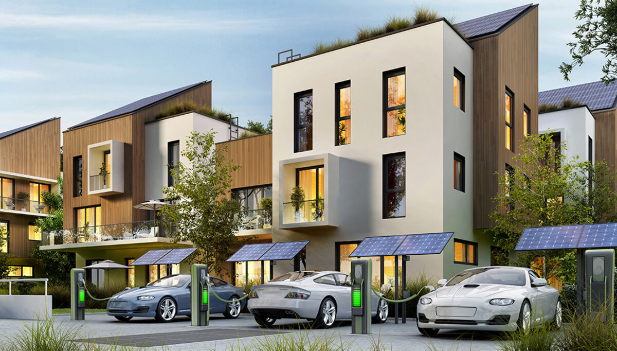 Modern apartment buildings and fast electric car charging statio