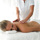 Young woman having back massaged